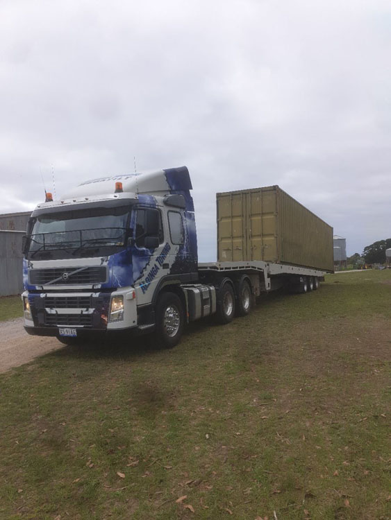 Portable Office Hire - A shipping container being delivered to a construction site office in country South Australia
