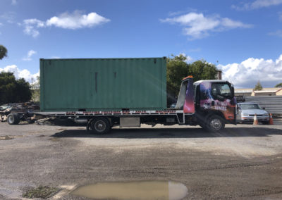 A second hand shipping container that has been sold being towed to the new owner at Salisbury