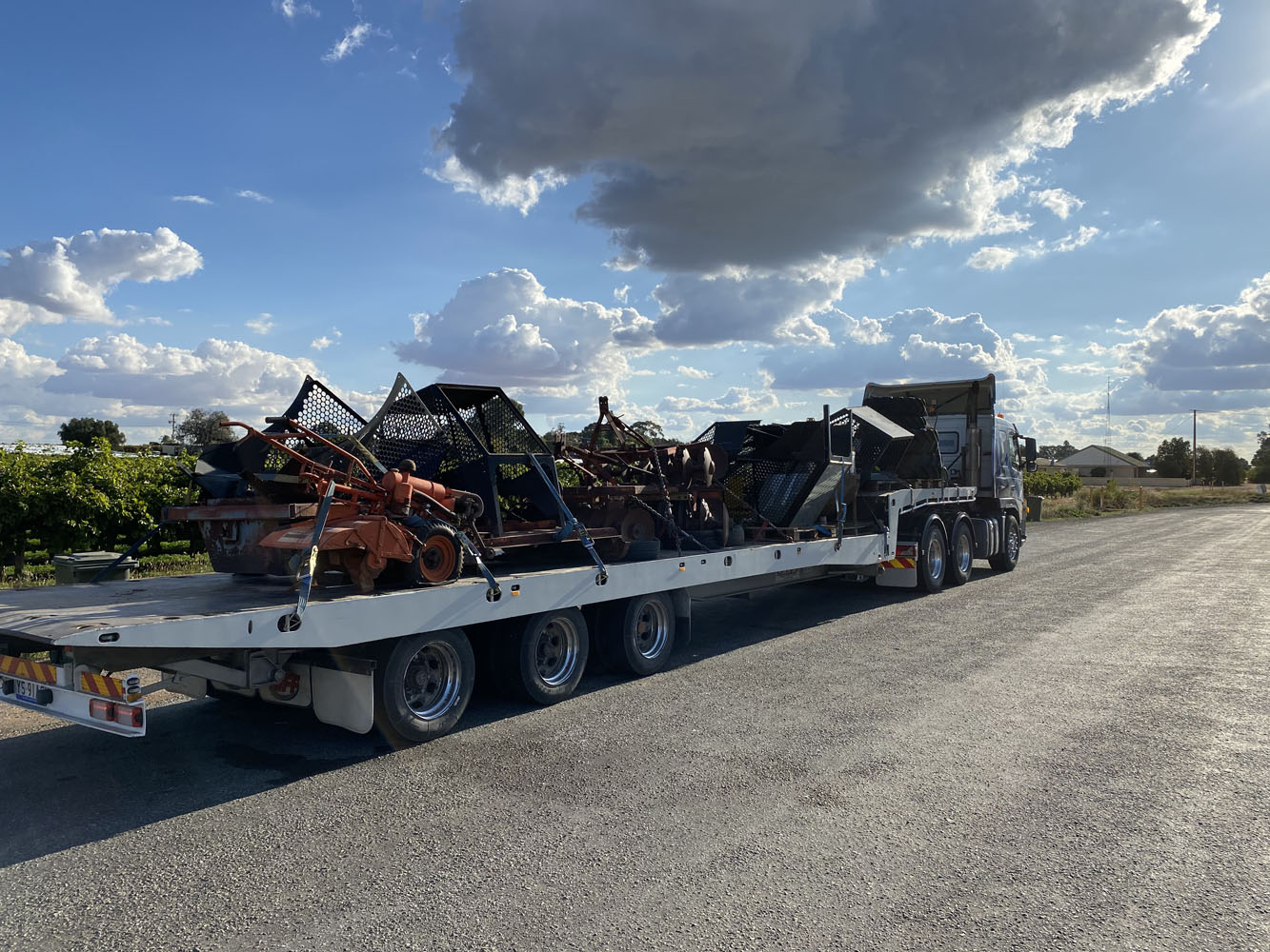 Large Tilt tray truck transporting heavy machinery on the Fleurieu Peninsula